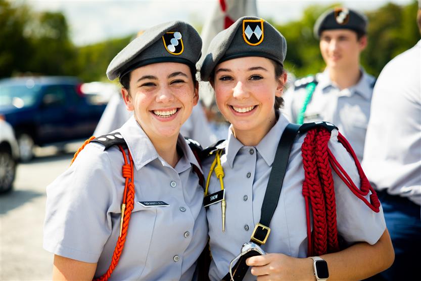 Two JROTC cadets smile
